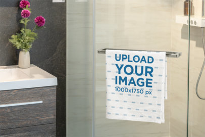 Mockup of a Folded Hand Towel Hanging on the Shower Door m40734