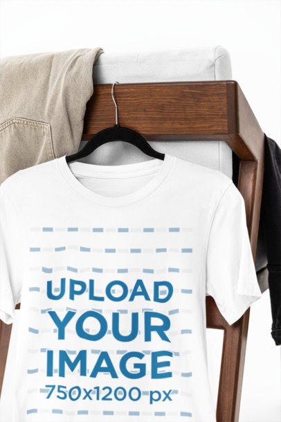 Mockup of a Round-Neck Bella Canvas T-Shirt Hanging on a Chair m39747