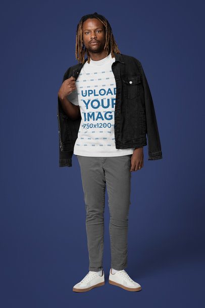 Mockup of a Man Wearing an Oversized T-Shirt Under a Denim Jacket 