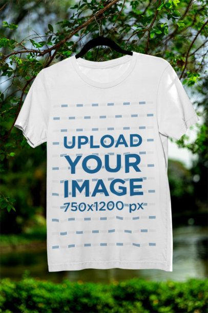 Mockup Featuring a Bella Canvas Crewneck T-Shirt Hanging from a Tree Branch m39832