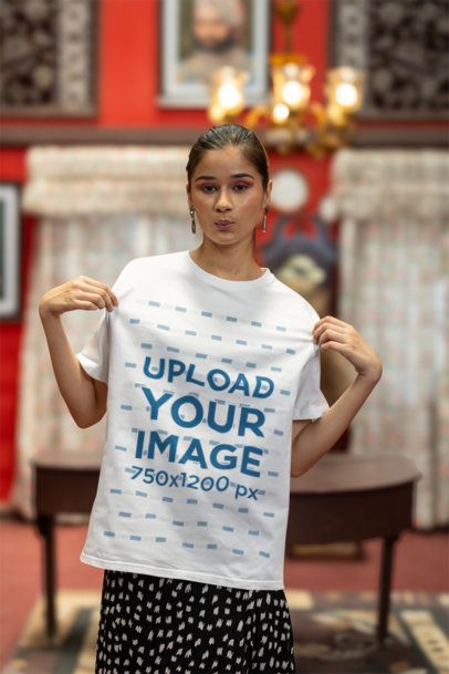 Mockup of a Woman Showing Her Blinkstore Round-Neck T-Shirt