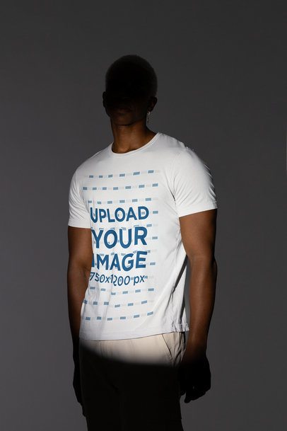 Bella Canvas Tee Mockup of a Man Under a Spotlight Wearing an Earring