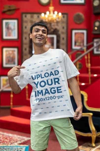 Mockup of a Smiling Man Pointing at His New Oversized Blinkstore Tee m40995