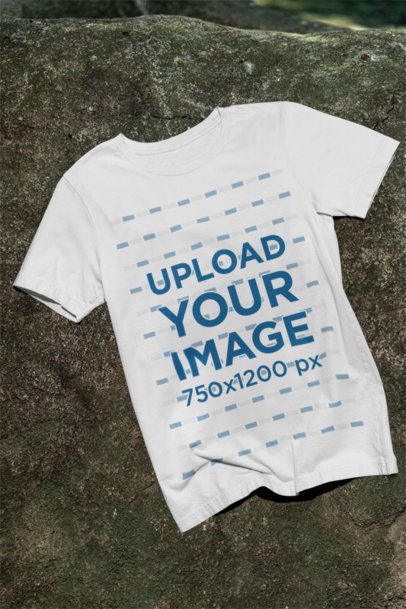 Mockup of a Bella Canvas T-Shirt Lying on a Rock m39835