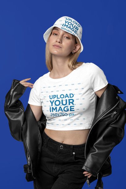Bella Canvas Crop Top Mockup of a Woman Posing in a Studio With a Sublimated Bucket Hat