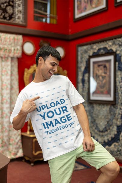 Mockup of a Joyful Man Happily Pointing at His Blinkstore T-Shirt m41005