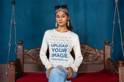 Bella Canvas Long-Sleeve Tee Mockup of a Woman Sitting in a Sofa Swing m40980
