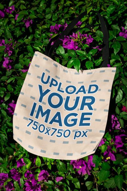 Sublimated Tote Bag Mockup Featuring a Floral Background With Leaves m39858