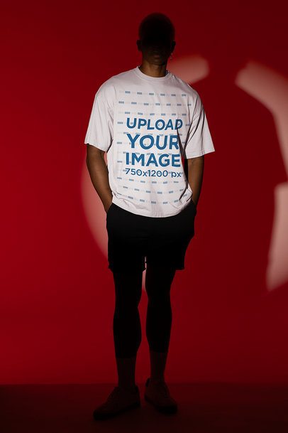 Mockup Featuring a Man with a Shaded Face Wearing a Rounded-Neck Tee
