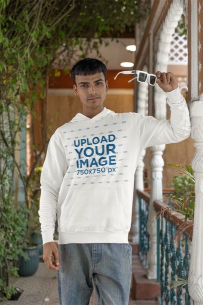 Gildan Hoodie Mockup Featuring a Gen Z Man Posing With Cool Sunglasses m40969