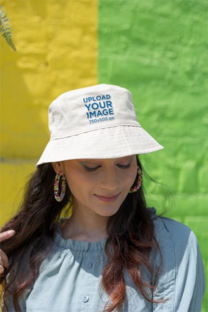 Mockup of a Gen Z Woman Wearing a Bucket Hat