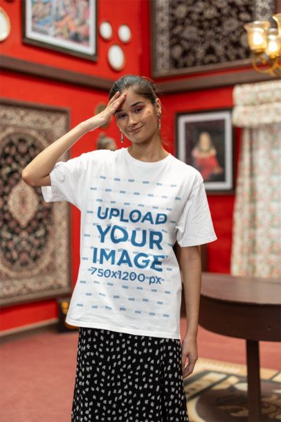 Oversized Blinkstore T-Shirt Mockup of a Smiling Woman Posing in a Red Room