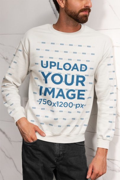 Homemade Feel Mockup of a Man in a Gildan Sweatshirt Leaning Against a Marble Wall