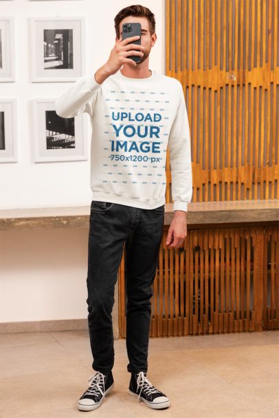 Mockup of a Man Taking a Selfie Wearing a Gildan Rounded-Neck Sweatshirt m50083