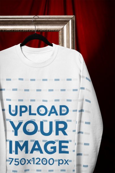 Mockup of a Gildan Sweatshirt Hanging from a Vintage Picture Frame m41080