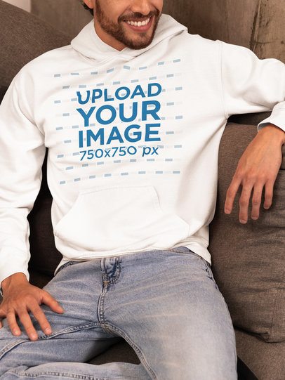 Gildan Hoodie Mockup of a Happy Cropped-Face Man Sitting on a Couch