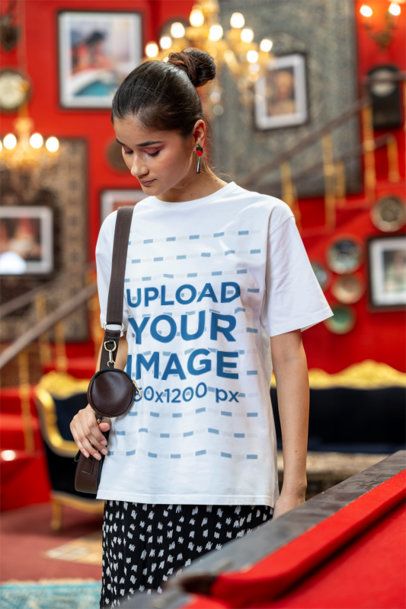 Oversized Blinkstore Tee Mockup of a Gen Z Woman Carrying a Purse m40997