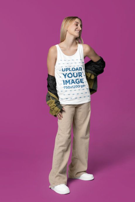 Mockup of a Joyful Woman Wearing a Bella Canvas Tank Top in a Studio