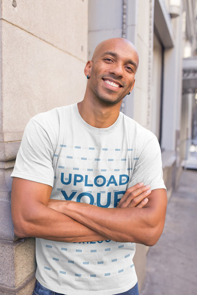 Mockup of a Smiling Man Wearing a T-Shirt on the Street