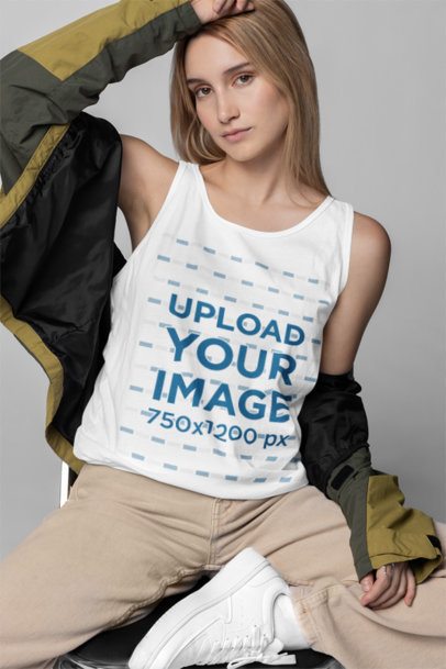 Studio Mockup of a Woman Wearing a Tank Top from Bella Canvas