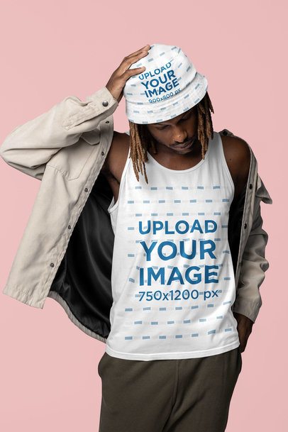 Bella Canvas Tank Top Mockup Featuring a Man Posing With a Bucket Hat