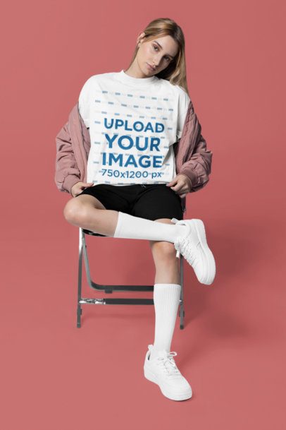 Mockup of a Woman Wearing an Oversized Crewneck T-Shirt in a Studio