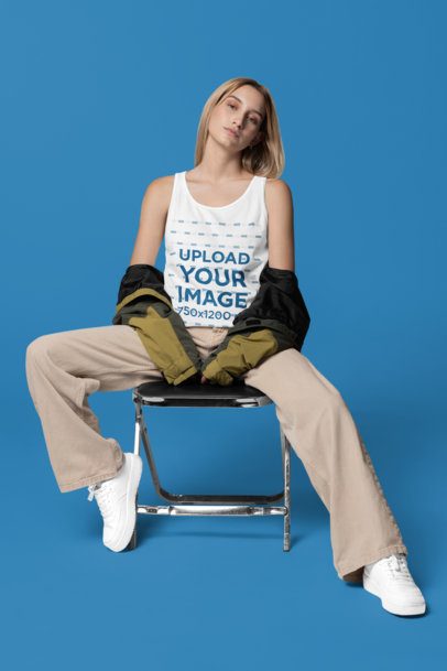 Bella Canvas Tank Top Mockup Featuring a Woman Sitting on a Chair in a Studio