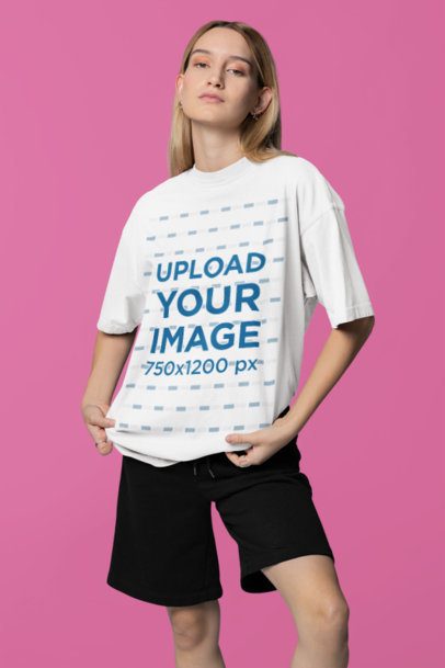 Mockup of a Woman Wearing an Oversized T-Shirt with a Rounded-Neck in a Studio