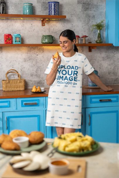 T-Shirt Dress Mockup Featuring a Cheerful Woman Looking at a Snack in a Kitchen