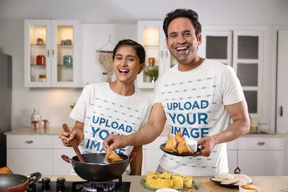 Scott International T-Shirt Mockup of a Smiling Man With His Teenage Daughter Cooking