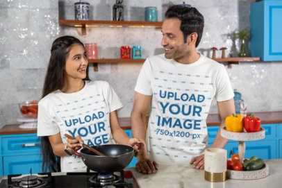 Scott International Tee Mockup of a Smiling Man and a Teenage Girl Cooking a Meal