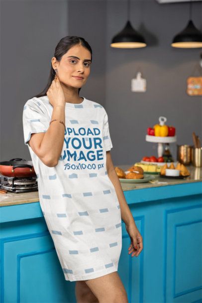 T-Shirt Dress Mockup Featuring a Woman With a Serious Look Posing in a Kitchen m41141