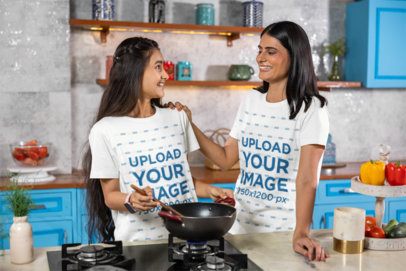Scott International Tee Mockup Featuring a Cheerful Teenage Girl Cooking With Her Mother