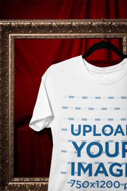 Mockup of a Round-Neck Gildan Tee Hanging from a Picture Frame m41087