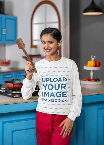 Bella Canvas Long-Sleeve Tee Mockup of a Smiling Teenage Girl Getting Ready to Cook