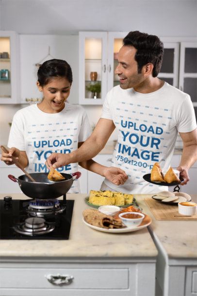 Scott International T-Shirt Mockup Featuring a Happy Man Cooking With His Teenage Daughter