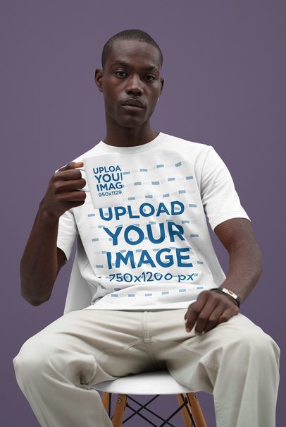 Bella Canvas T-Shirt Mockup Featuring a Serious Man Holding a 15 Oz Coffee Mug