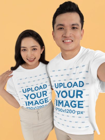 Mockup of a Man and a Woman Taking a Selfie Wearing Matching T-Shirts