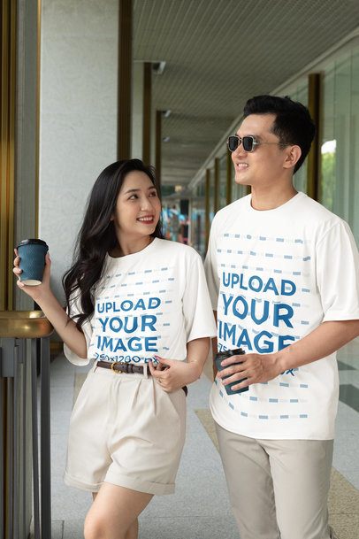 Mockup Featuring a Man and a Woman Wearing Oversized T-Shirts Together