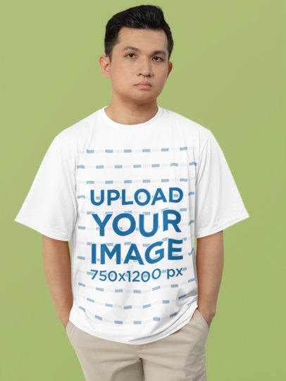 Mockup of a Man Wearing a T-Shirt with a Round Neck in a Studio with a Solid Background