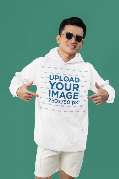 Mockup of a Happy Man with Sunglasses Pointing at His New Pullover Hoodie 