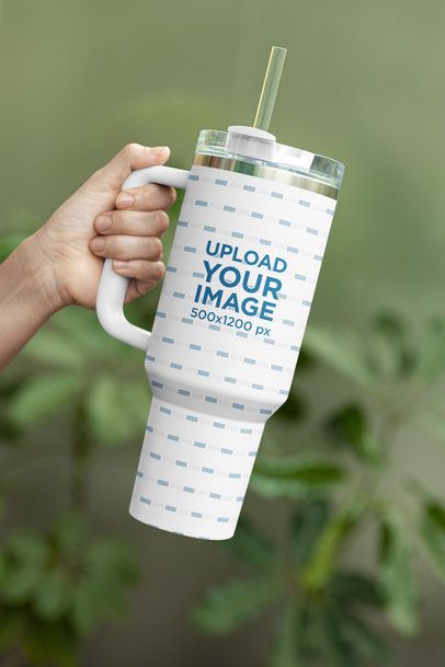 Mockup of a Person's Hand Holding a Sublimated Stanley Tumbler