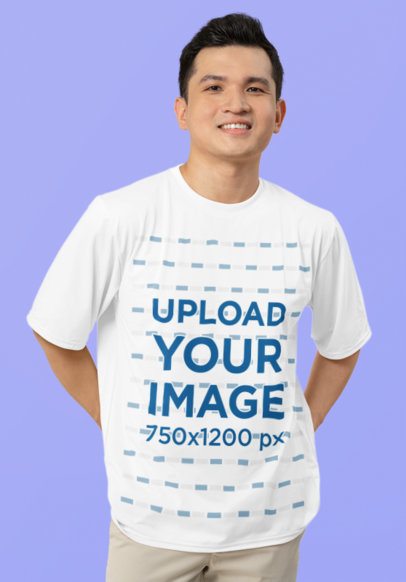 T-Shirt Mockup Featuring a Smiling Man Posing in a Studio with a Purple Background