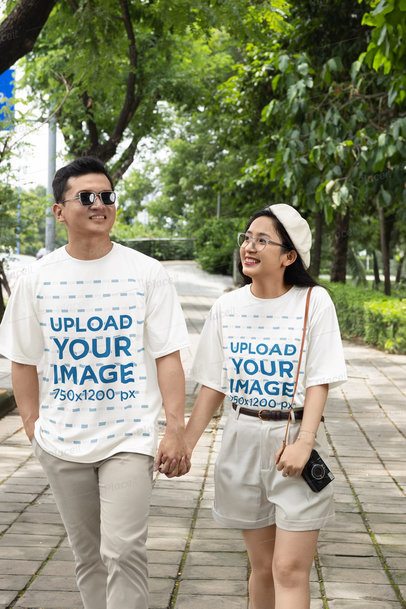 Crewneck Tee Mockup of a Man and a Woman Walking Hand-in-Hand at a Park m50551