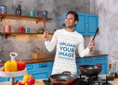 Bella Canvas Long-Sleeve Tee Mockup of a Happy Man Holding Cooking Spoons