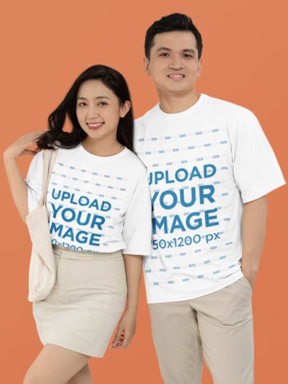 Mockup Featuring a Joyful Couple Wearing Round-Neck T-Shirts in a Studio