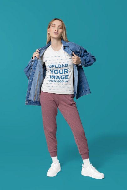 Bella Canvas Tee Mockup Featuring a Woman With a Denim Jacket Posing With a Serious Look m40836