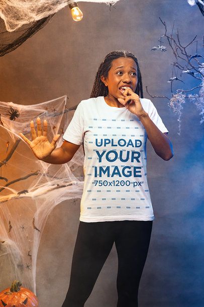 Bella Canvas T-Shirt Mockup of a Fearful Woman in a Haunted House