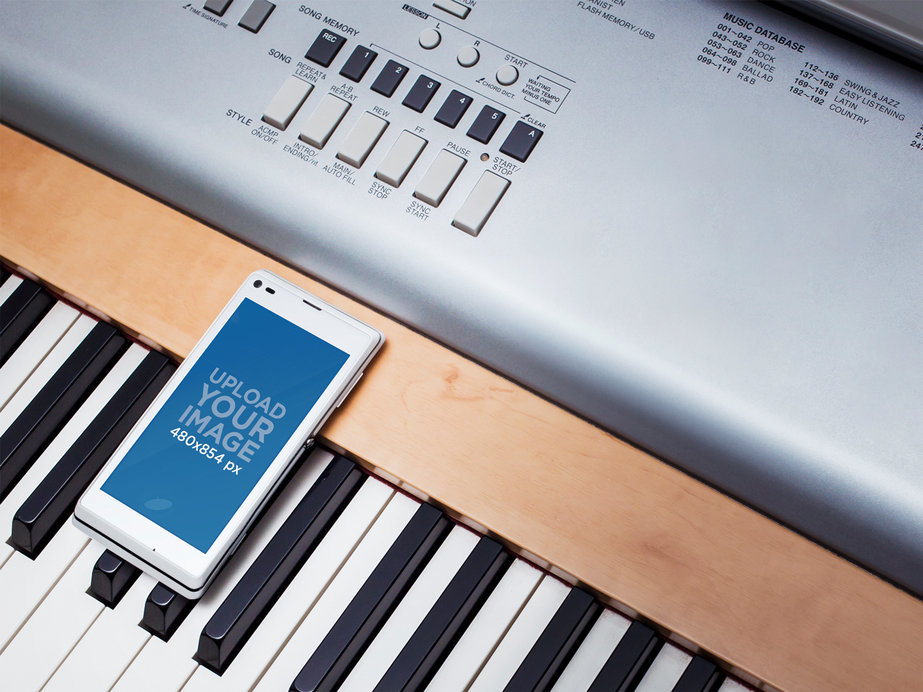 Mockup Template of White Sony Xperia on Piano Keyboard