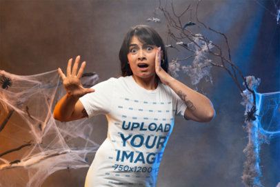 Halloween-Themed Mockup of a Woman with a Scared Face Wearing a Bella Canvas Tee